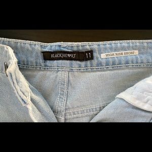 Black heart ripped shorts